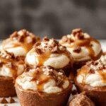 Elegant glass cups filled with rich, creamy chocolate mousse topped with salted caramel drizzle and a sprinkle of sea salt